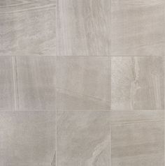 a tile floor with different shades of gray