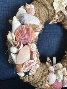 a wreath made out of rope and seashells