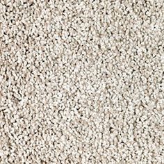 a close up view of the texture of a carpet that is white and beige in color