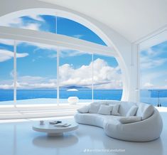 a living room filled with white furniture and large windows overlooking the ocean on a sunny day