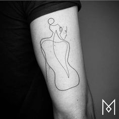 a black and white photo of a woman's arm with a line drawing on it