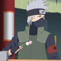 an anime character with white hair and black eyes is holding cotton candy in his hand