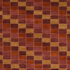 an orange and brown rug with squares on it