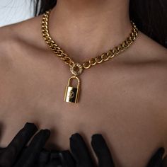 Be bold and stand out with the Tempo Necklace! Featuring a distinct, repurposed lock, this one-of-a-kind statement necklace makes a powerful impression. With its unique design, it'll be sure to turn heads and be noticed wherever you go. -16" length with 2" extender chain -10mm cuban links -18k gold plating over stainless steel cuban link chain -Cubic zirconia stones Lock Chain, Jewel Necklace, Jewelry Lookbook, Cuban Link Chain, Earring Sale, Cuban Link, Be Bold, Pretty Jewellery, Silver Pearls