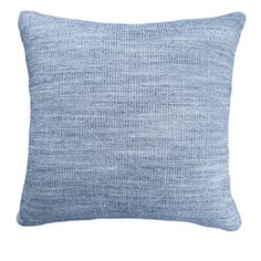 a blue pillow on a white background