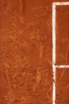 a tennis court with a white line painted on the wall and in the middle of it