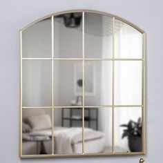 a mirror that is hanging on the wall