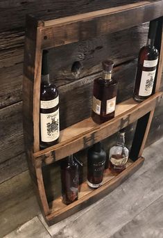 an old wooden shelf with bottles on it