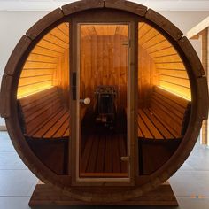 the inside of a wooden sauna is shown with its reflection in the glass door