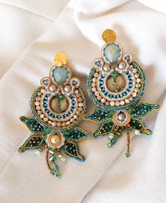 Green Mint Soutache Earrings.  Crafted with precision, these vibrant accessories feature glass crystals and beads, adding a touch of elegance to your sunny days. Embrace the freshness of mint and let these earrings be your perfect summer statement. Vibrant Accessories, Green Chandelier, Green Chandeliers, Boho Clothes, Soutache Earrings, Summer Earrings, Soutache Jewelry, Green Mint, Party Earrings