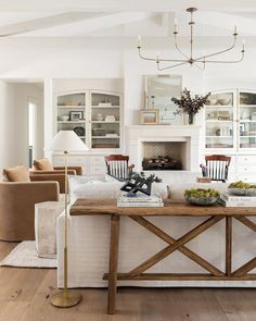 a living room filled with furniture and a fire place