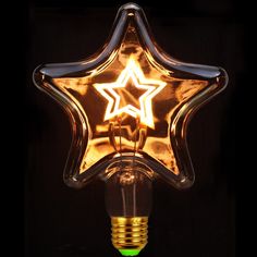 a star shaped light bulb is lit up in the shape of a lampbulb