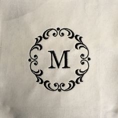 a monogrammed pillow with the letter m on it