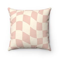 a pink and white checkered pillow on a white background