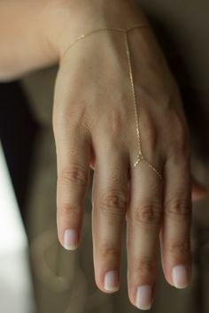 14K Gold Hand Chain / Minimalist Hand Bracelet/Shahmaran 14K Gold Sahmeran Bracelet Hand Bracelet include 1 cm extension ring Weight:~1,10-1,15  gr Made by 14K - 585  solid gold chain.  It's not plated or vermeil gold Free Fedex express shipping in 2-7 business days. Please measure your wrist dimension as instructed at 2th photo. Don't put extra measure on exact wrist circumference size. We find the required size by making the necessary addition on your wrist circumference measurement. so don't Gold Hand Chain, Hand Chain Jewelry, Finger Bracelets, Hand Chain Bracelet, Pretty Jewelry Necklaces, Ring Bracelet Chain, Gold Rings Jewelry, Solid Gold Chains, Hand Bracelet