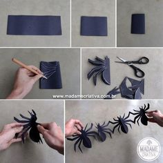 an image of someone cutting out paper spiders on the wall with scissors and glue