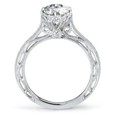 a white gold engagement ring with an intricate design