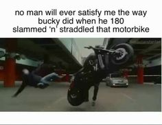 a person on a motorcycle doing a trick in the air with another person behind him