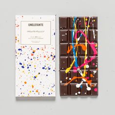 the chocolate bar is decorated with multicolored splatkles and white paper