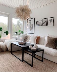 a living room filled with lots of white furniture