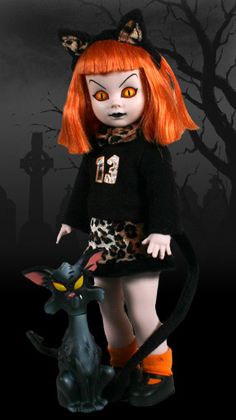 a doll with red hair and orange eyes holding a black cat in front of a halloween scene