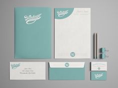 the stationery is clean and ready to be used for business cards, envelopes, pens and paper