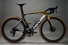 a black and yellow bike is shown against a gray background with the words genvo written on it