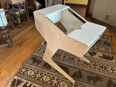 a wooden chair sitting on top of a hard wood floor