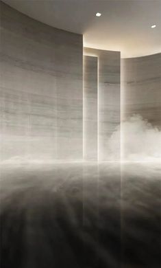 an empty room with columns and fog in the air, as if it were floating on water