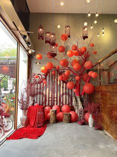 a room with red decorations and lights hanging from the ceiling