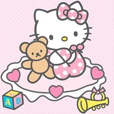 a hello kitty sitting on top of a cake with a teddy bear