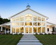 a white house with stairs leading up to it