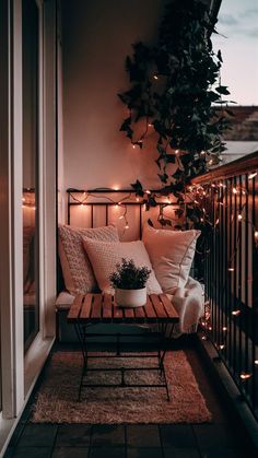 the balcony is decorated with string lights and potted plants, along with a bench