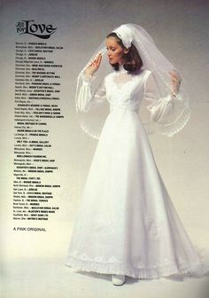 a woman in a white wedding dress and veil