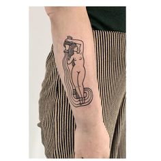 a person with a tattoo on their arm