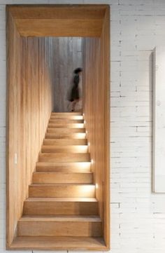 the stairs are made of wood and have lights on them