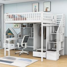 a loft bed with desk underneath and stairs to the upper level, next to a window