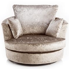 a round chair with two pillows on it