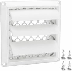 two white plastic shelves with screws on each side and four holes in the middle