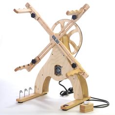 a wooden machine that is connected to wires