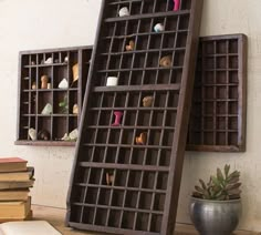 two books are stacked on top of each other in front of an open bookcase