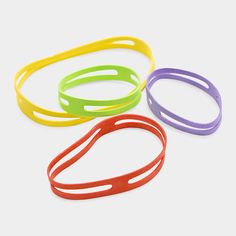 three different colored rubber bracelets on a white background with space for text or image