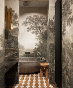 a bathroom with a tub and wall paper