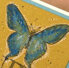 a close up of a card with a butterfly on it