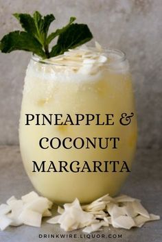 pineapple and coconut margarita in a glass with the words pineapple and coconut margarita