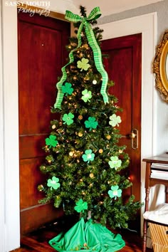 a decorated christmas tree with shamrocks on it