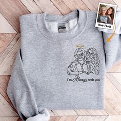 Introducing our Personalized Photo Embroidered Sweatshirt a unique and heartwarming way to showcase your cherished memories. Crafted with care, this sweatshirt features an intricately embroidered photo, creating a wearable masterpiece that captures the essence of your special moments. Whether it's a picture of a loved one, a cherished pet, or a memorable event, our Personalized Photo Embroidered Sweatshirt turns your favorite photos into a one-of-a-kind garment. It serves as a comforting Memoria Expressing Sympathy, Embroidered Photo, Mom Daughter Gifts, Canvas Beach Bag, Forever In My Heart, Hoodie White, Family Friend, Embroidered Sweatshirt, Embroidered Sweatshirts