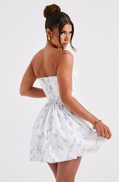 This mini is having a moment! Made in a premium cotton blend fabric, this strapless design features a boned corset to snatch the waist and a super full skirt. The look is complete with delicate lace trims and shirring to the back. 



Colour: Blue Ditsy Print.

Premium non-stretch cotton blend fabric.

Fully lined.

Strapless with lace trim.

Gathered, underwired cups.

Boning in corset.

Lace trim detail.

Super full skirt.

Shirred back detail.

Mini length.

Model is an XS and is wearing an X Homecoming Dresses Corset, White Dress Spring, Midi Dress Wedding Guest, Mini Tube Dress, Ditsy Print, Maxi Dress Sale, Sparkle Dress, Dresses By Length, Formal Dresses Prom