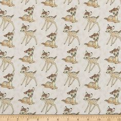 a white fabric with brown and tan deers on it