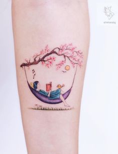 a woman sitting in a hammock under a tree with music notes on it